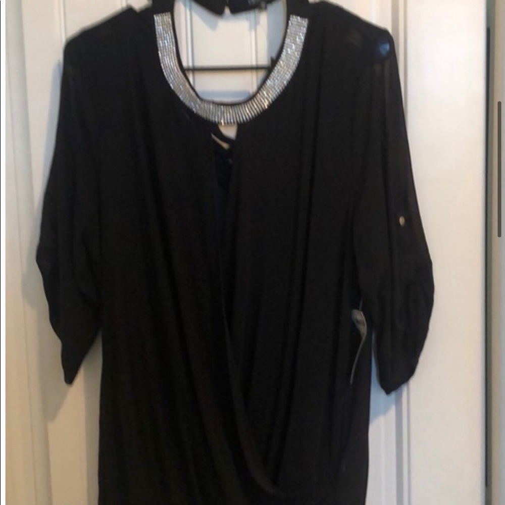 Gorgeous black top with rhinestones and low cut